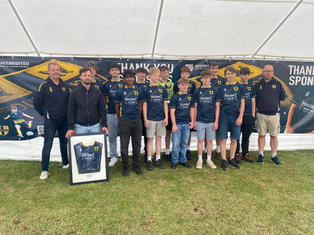 Local youth football players in Massimo’s-sponsored shirts